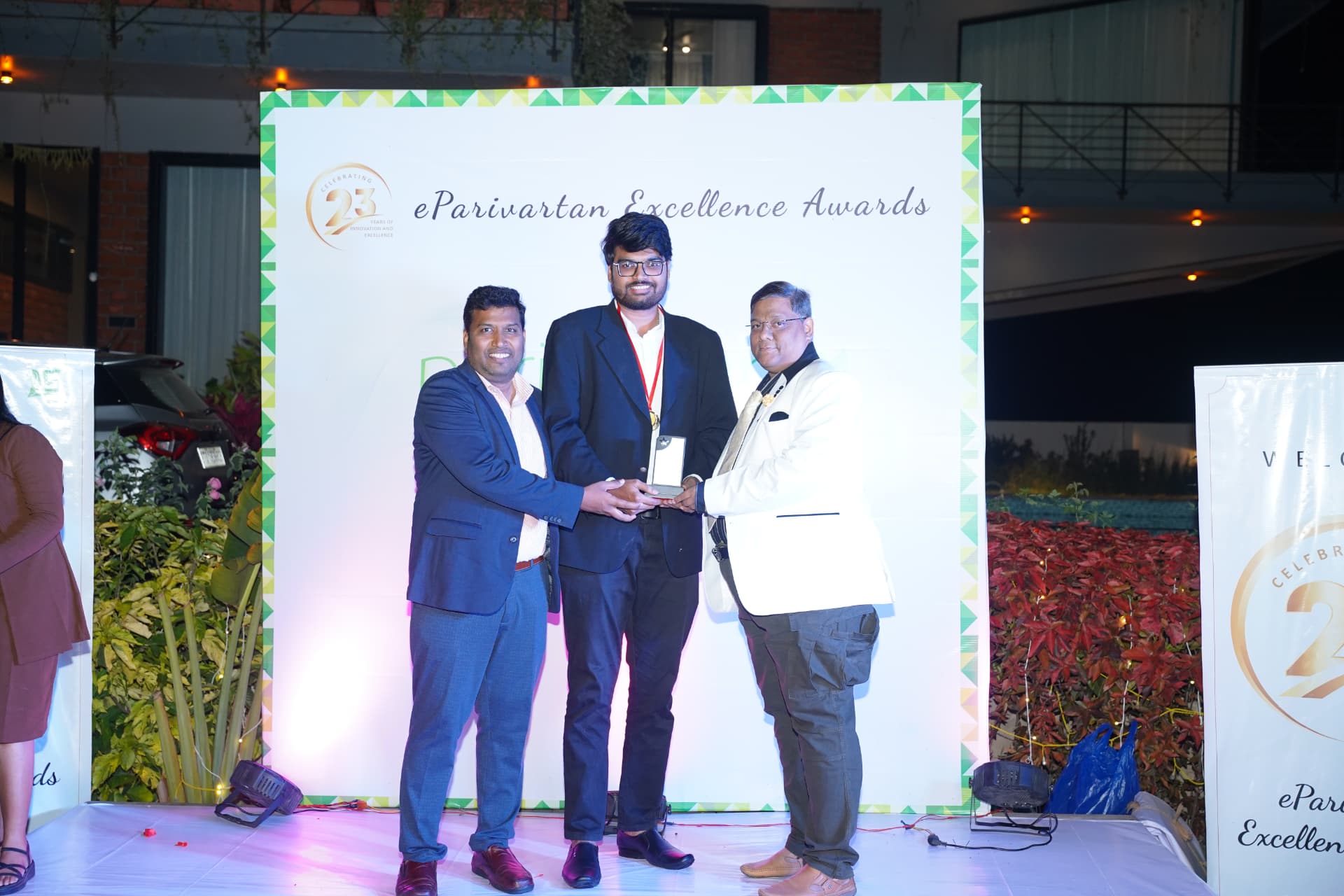 Surya Teja Naidu receiving an award on stage at the eParivartan Excellence Awards